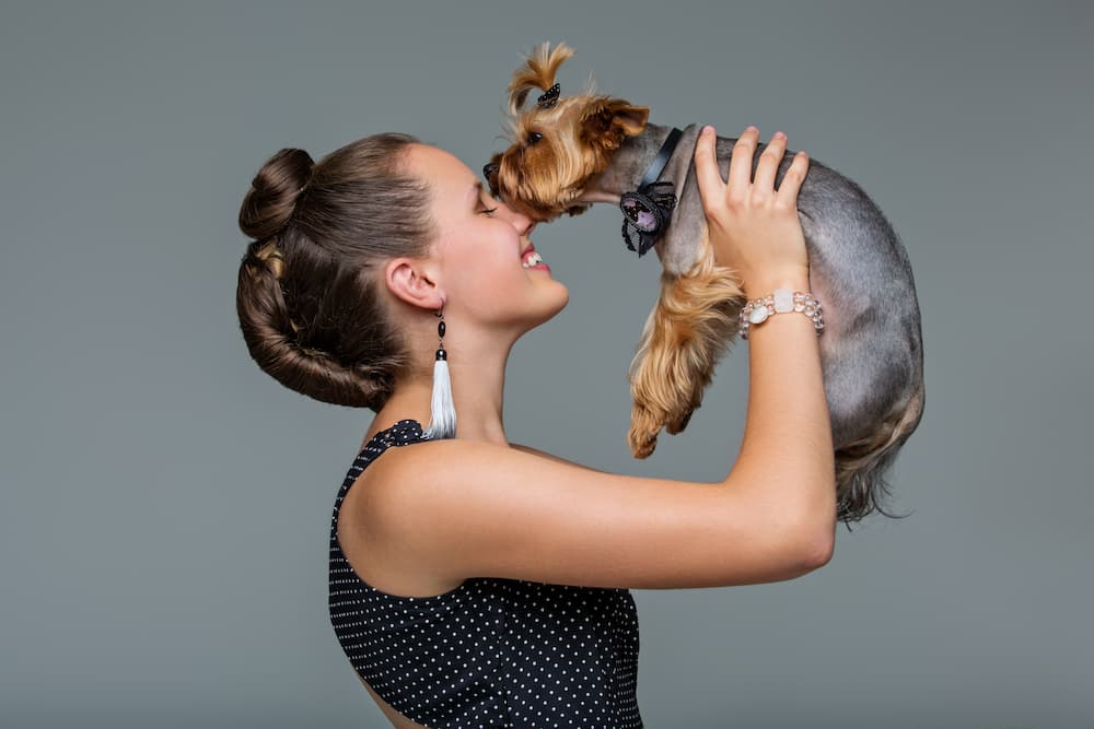 girl with yorkie dog